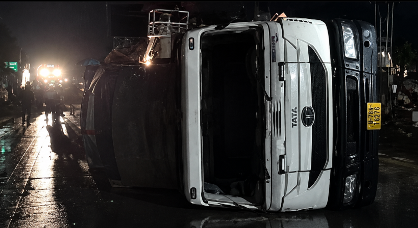 Overturned vehicle at the Rewa bus crash site in Madhya Pradesh as emergency teams conduct rescue operations at night.